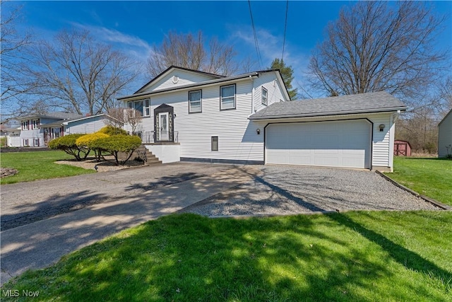 1863 Beaver Trl, Mineral Ridge, OH 44440 - view of front of house with an attached garage, driveway, and a front lawn