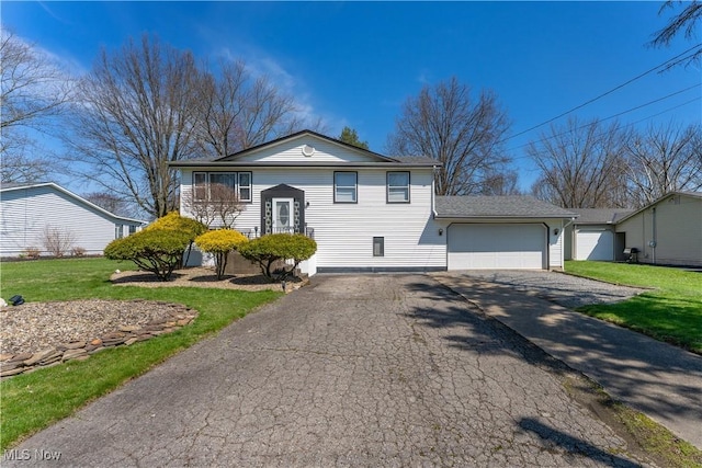 1863 Beaver Trl, Mineral Ridge, OH 44440 - raised ranch with a front yard, an attached garage, and driveway