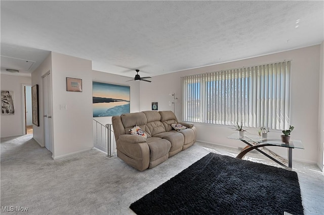 1863 Beaver Trl, Mineral Ridge, OH 44440 - living area with baseboards, a ceiling fan, attic access, and carpet