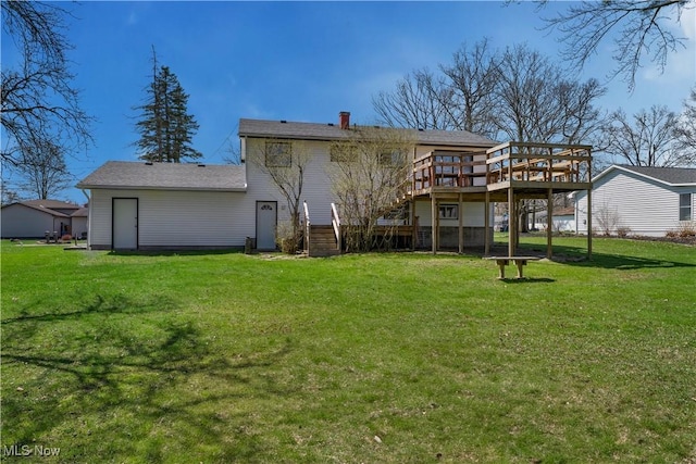 1863 Beaver Trl, Mineral Ridge, OH 44440 - rear view of property featuring a yard, a wooden deck, and stairway