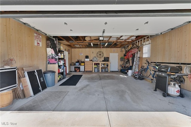 1863 Beaver Trl, Mineral Ridge, OH 44440 - garage featuring wooden walls