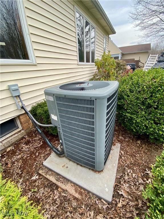 exterior details featuring central AC