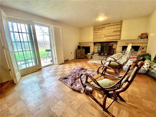 sitting room with a fireplace and light floors