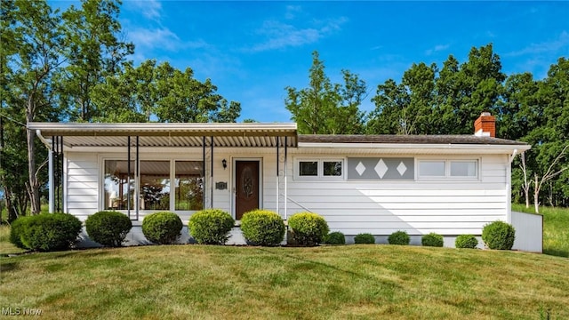 165 Reservoir Rd, New Concord, OH 43762 - single story home with a front lawn and a chimney