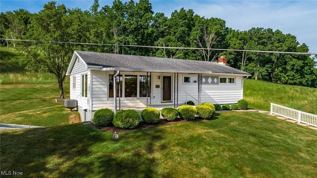 165 Reservoir Rd, New Concord, OH 43762 - single story home featuring central air condition unit, a chimney, a front lawn, and covered porch