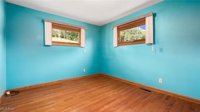 165 Reservoir Rd, New Concord, OH 43762 - unfurnished room with visible vents, baseboards, and wood finished floors