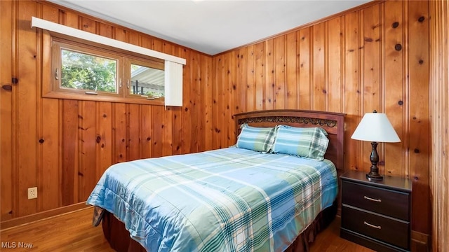 165 Reservoir Rd, New Concord, OH 43762 - bedroom featuring wood walls, baseboards, and wood finished floors