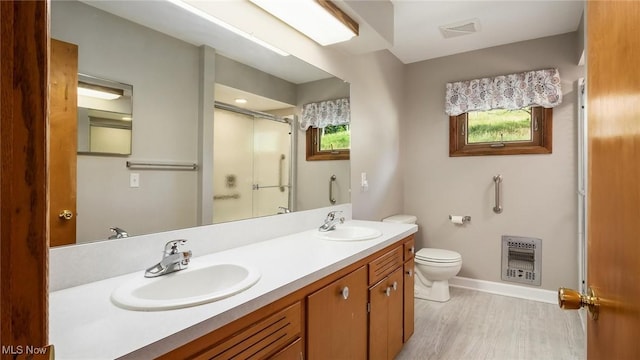 165 Reservoir Rd, New Concord, OH 43762 - full bathroom with toilet, a stall shower, a sink, and heating unit