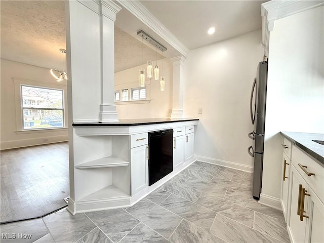kitchen featuring decorative columns, a wealth of natural light, freestanding refrigerator, and black dishwasher