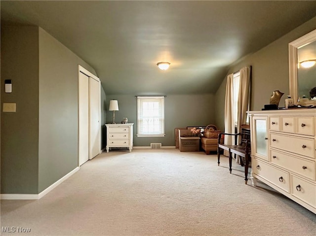835 John St, Niles, OH 44446 - living area featuring light carpet, baseboards, lofted ceiling, and visible vents