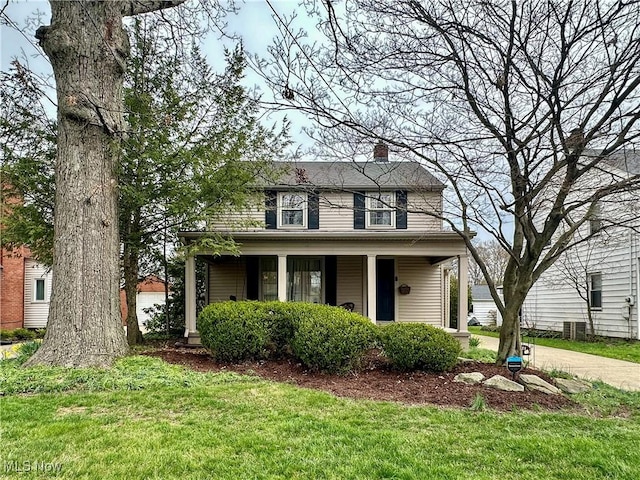 835 John St, Niles, OH 44446 - view of front of property with a chimney and a front lawn