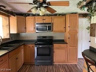 1317 Josephine St, Toronto, OH 43964 - kitchen featuring stainless steel appliances, a sink, dark wood-style floors, and ceiling fan