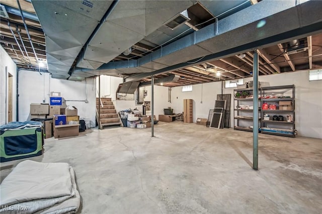 basement with visible vents and stairs