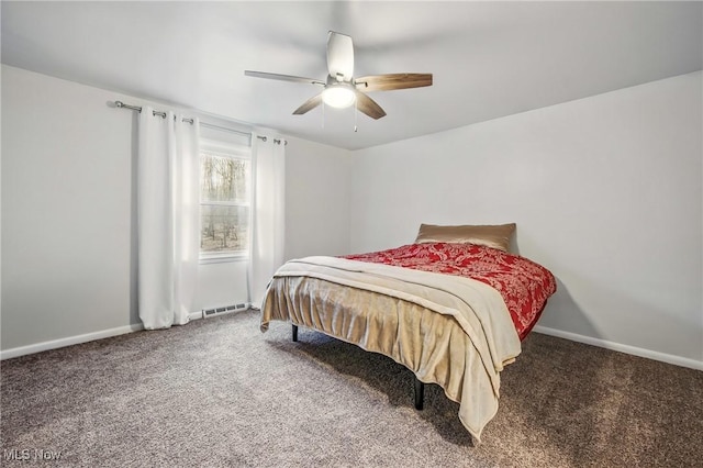 carpeted bedroom featuring visible vents, baseboards, and a ceiling fan