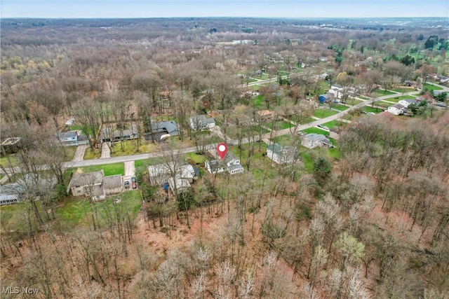bird's eye view featuring a view of trees and a residential view