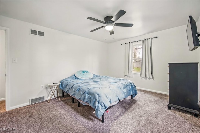 carpeted bedroom featuring visible vents, baseboards, and a ceiling fan