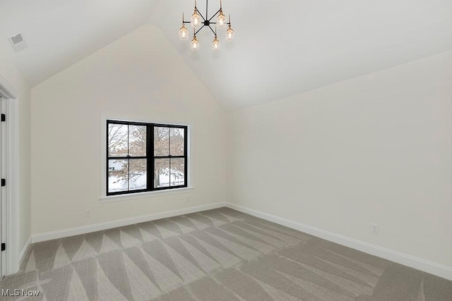 2762 Rocky Ridge Dr, Westlake, OH 44145 - unfurnished room featuring visible vents, baseboards, an inviting chandelier, light colored carpet, and lofted ceiling