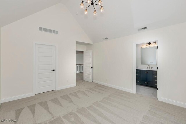 2762 Rocky Ridge Dr, Westlake, OH 44145 - unfurnished bedroom featuring a sink, visible vents, high vaulted ceiling, and an inviting chandelier