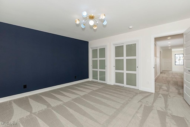 2762 Rocky Ridge Dr, Westlake, OH 44145 - unfurnished room with light carpet and an inviting chandelier