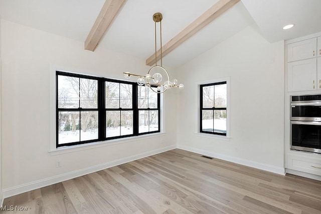 2762 Rocky Ridge Dr, Westlake, OH 44145 - unfurnished dining area featuring a wealth of natural light, light wood-style floors, visible vents, and an inviting chandelier