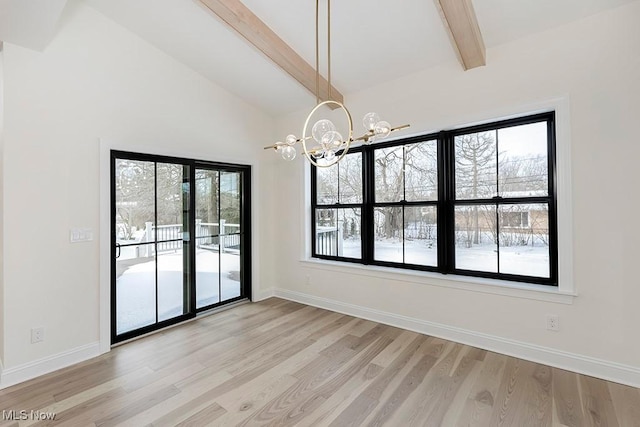 2762 Rocky Ridge Dr, Westlake, OH 44145 - unfurnished dining area with baseboards, light wood-type flooring, a notable chandelier, and lofted ceiling with beams