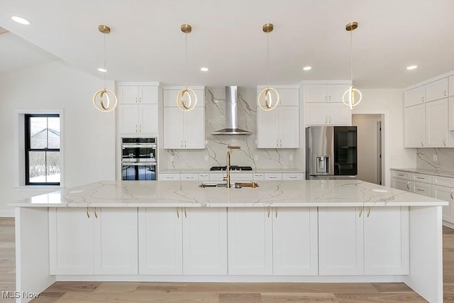 2762 Rocky Ridge Dr, Westlake, OH 44145 - kitchen with a large island, wall chimney range hood, backsplash, white cabinets, and stainless steel appliances