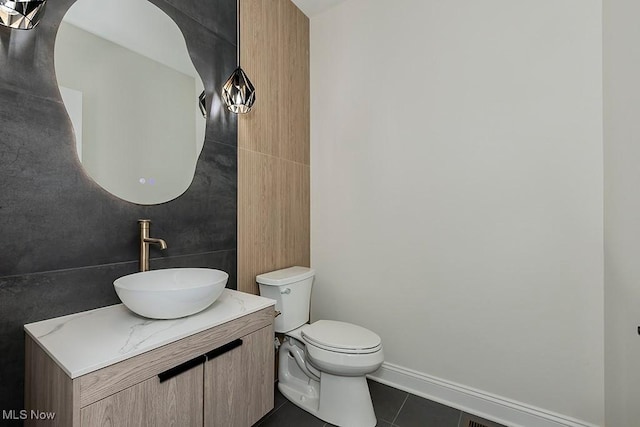 2762 Rocky Ridge Dr, Westlake, OH 44145 - bathroom with tile patterned floors, vanity, baseboards, and toilet