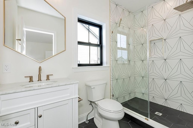 2762 Rocky Ridge Dr, Westlake, OH 44145 - bathroom with baseboards, toilet, a tile shower, vanity, and tile patterned flooring