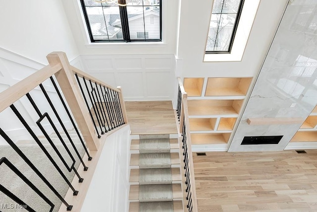 2762 Rocky Ridge Dr, Westlake, OH 44145 - stairs featuring a decorative wall and wood finished floors