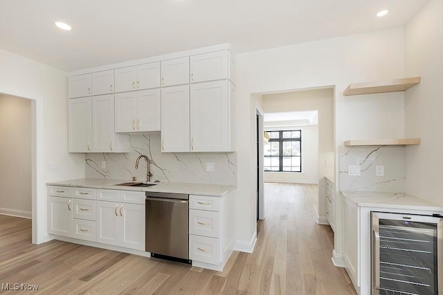 2762 Rocky Ridge Dr, Westlake, OH 44145 - kitchen with stainless steel dishwasher, open shelves, a sink, wine cooler, and light wood finished floors