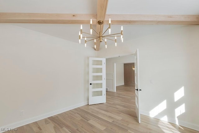 2762 Rocky Ridge Dr, Westlake, OH 44145 - empty room with baseboards, an inviting chandelier, light wood-style flooring, beam ceiling, and high vaulted ceiling