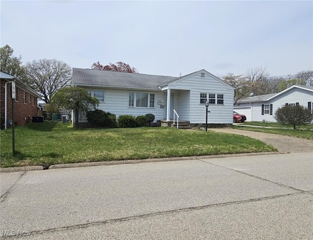 3509 11th Ave, Vienna, WV 26105 - view of front facade with driveway and a front yard