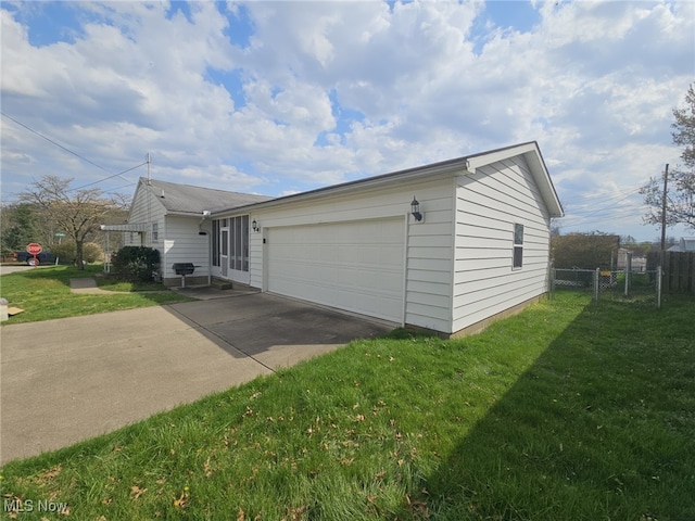 3509 11th Ave, Vienna, WV 26105 - view of property exterior with a yard, an attached garage, fence, and driveway