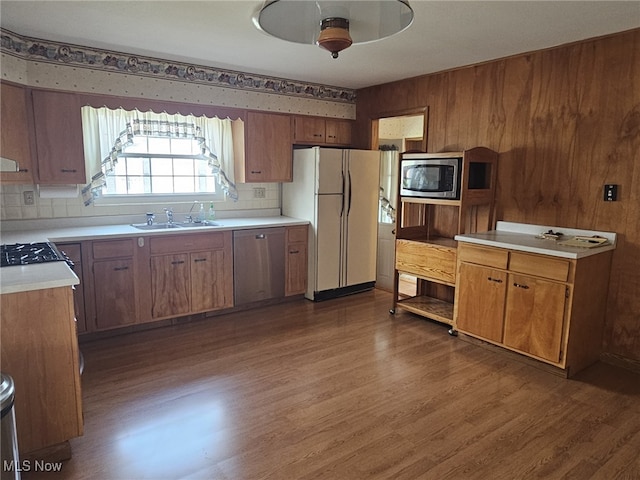3509 11th Ave, Vienna, WV 26105 - kitchen with appliances with stainless steel finishes, wood finished floors, light countertops, brown cabinets, and ceiling fan