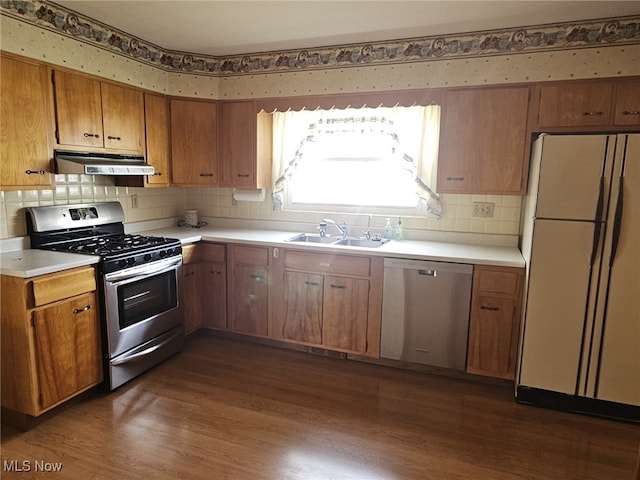 3509 11th Ave, Vienna, WV 26105 - kitchen with appliances with stainless steel finishes, dark wood-style flooring, a sink, and under cabinet range hood