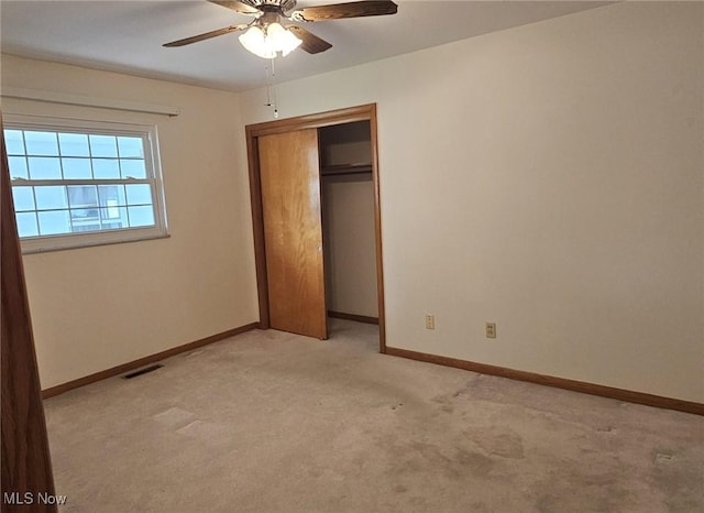 3509 11th Ave, Vienna, WV 26105 - unfurnished bedroom featuring a closet, baseboards, light carpet, visible vents, and ceiling fan