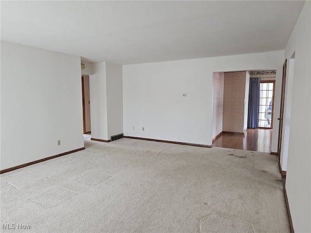 3509 11th Ave, Vienna, WV 26105 - spare room with carpet, visible vents, and baseboards