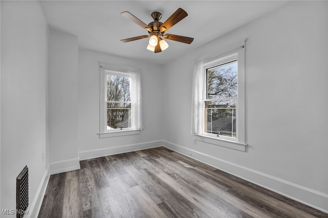spare room featuring visible vents, baseboards, and a healthy amount of sunlight