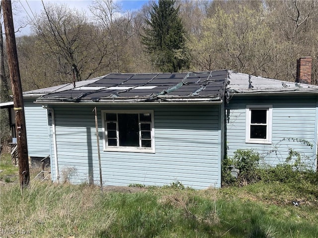 276 Drain St, East Liverpool, OH 43920 - view of side of home featuring a chimney