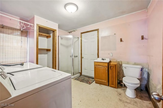 laundry area featuring a sink, light floors, separate washer and dryer, and laundry area