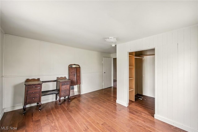unfurnished bedroom featuring wood finished floors