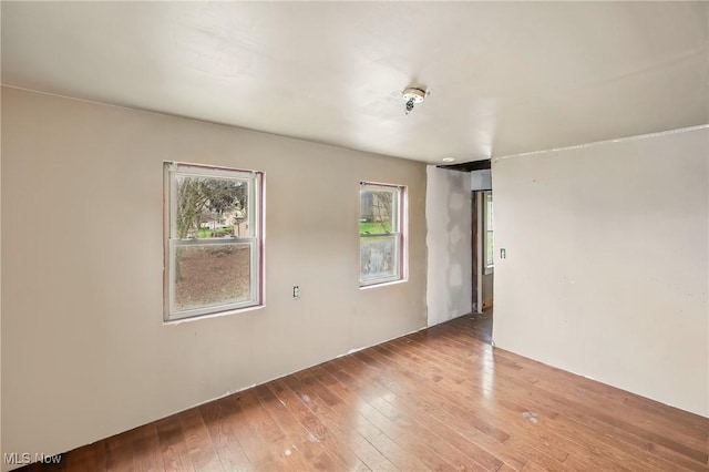 unfurnished room featuring wood-type flooring