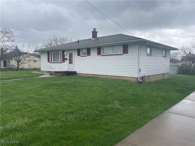 301 E Howard St, Girard, OH 44420 - view of front of home featuring a chimney and a front lawn
