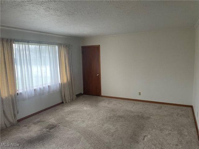 301 E Howard St, Girard, OH 44420 - unfurnished room featuring baseboards, light colored carpet, a textured ceiling, and ornamental molding