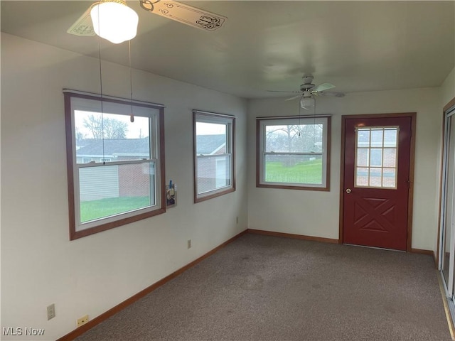 301 E Howard St, Girard, OH 44420 - carpeted foyer entrance featuring a wealth of natural light, a ceiling fan, and baseboards