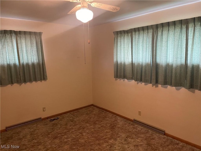 301 E Howard St, Girard, OH 44420 - spare room featuring ceiling fan, baseboards, carpet, and visible vents