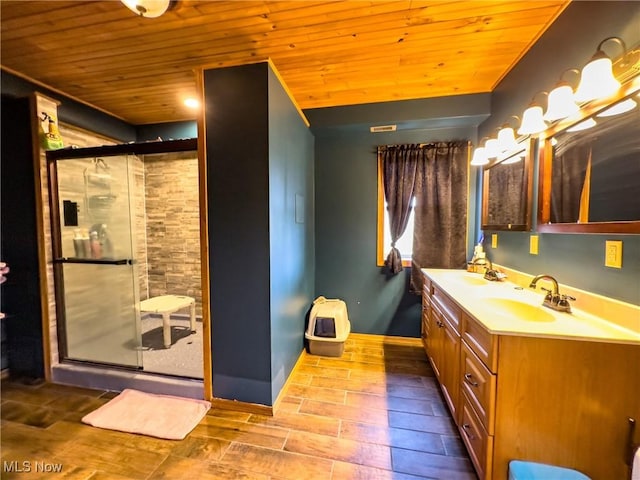 bathroom featuring double vanity, wood ceiling, a sink, and a stall shower