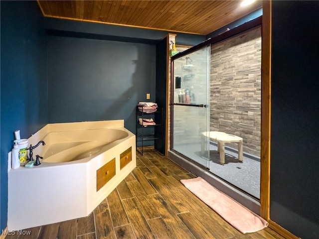 full bathroom with a shower stall, wooden ceiling, and wood finished floors