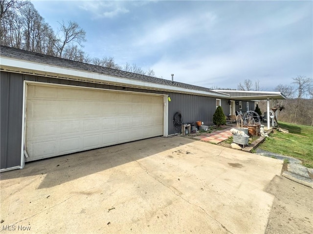 ranch-style home featuring an attached garage and driveway