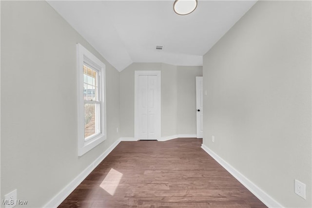 1244 W 69th St, Cleveland, OH 44102 - empty room with visible vents, baseboards, dark wood-style floors, and lofted ceiling